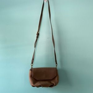 Taupe crossbody bag. Fits phone, keys, small wallet. Button closure